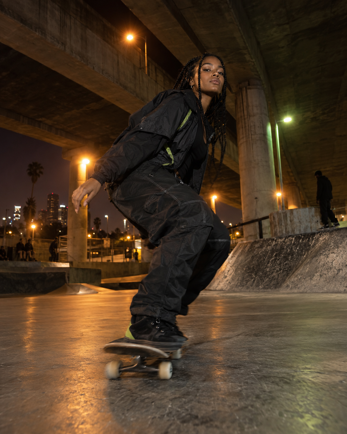 Skateboarder moving through the city at night